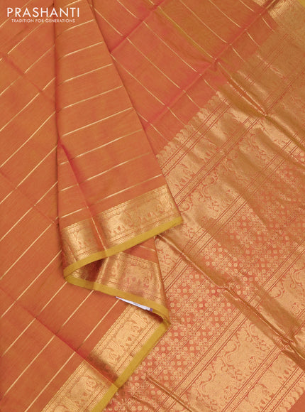 Kanchi cotton saree dual shade of pinkish mustard with allover zari stripe pattern and elephant zari woven border