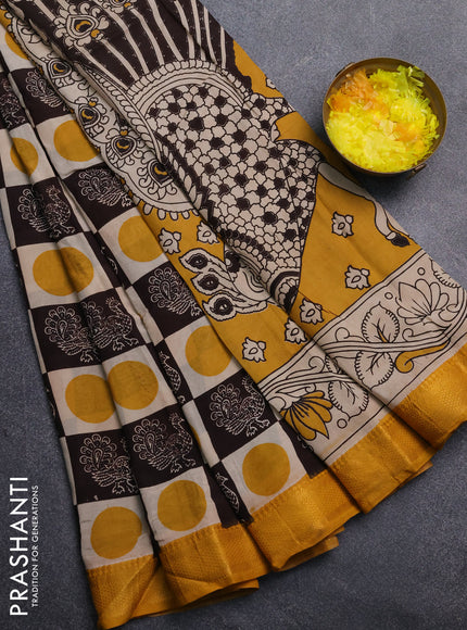 Kalamkari semi silk saree beige coffee brown and yellow with allover prints and mangalgiri border