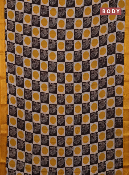 Kalamkari semi silk saree beige coffee brown and yellow with allover prints and mangalgiri border