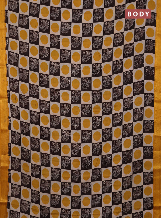 Kalamkari semi silk saree beige coffee brown and yellow with allover prints and mangalgiri border