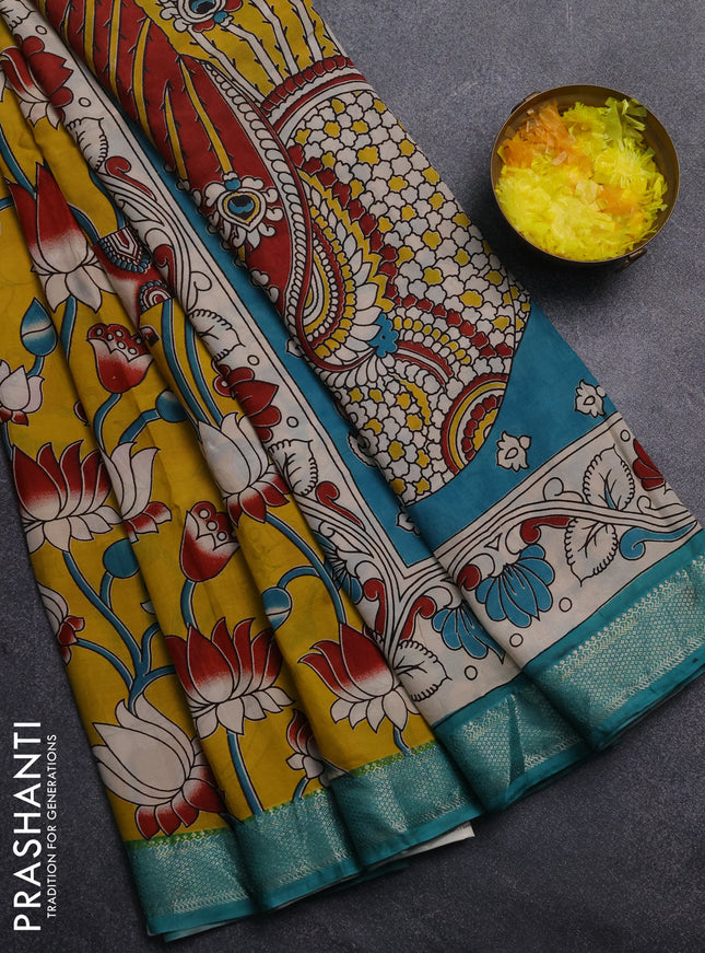 Kalamkari semi silk saree yellow and teal green with allover prints and mangalgiri border