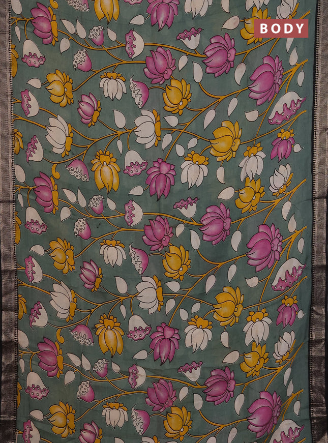 Kalamkari semi silk saree pastel green and black with allover prints and mangalgiri border