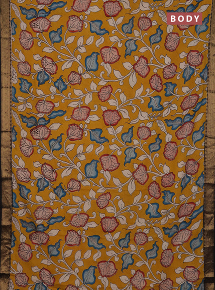 Kalamkari semi silk saree mustard yellow and black with allover prints and mangalgiri border