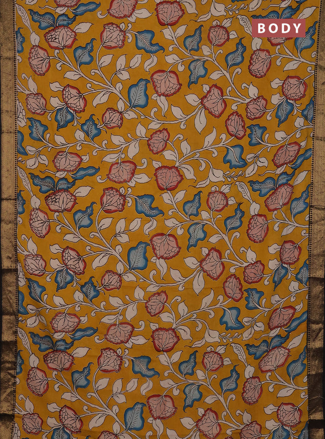 Kalamkari semi silk saree mustard yellow and black with allover prints and mangalgiri border