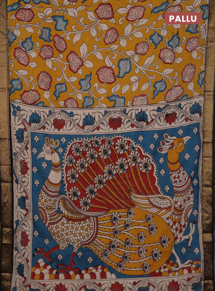 Kalamkari semi silk saree mustard yellow and black with allover prints and mangalgiri border
