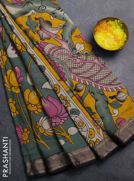 Kalamkari semi silk saree pastel green and black with allover prints and mangalgiri border