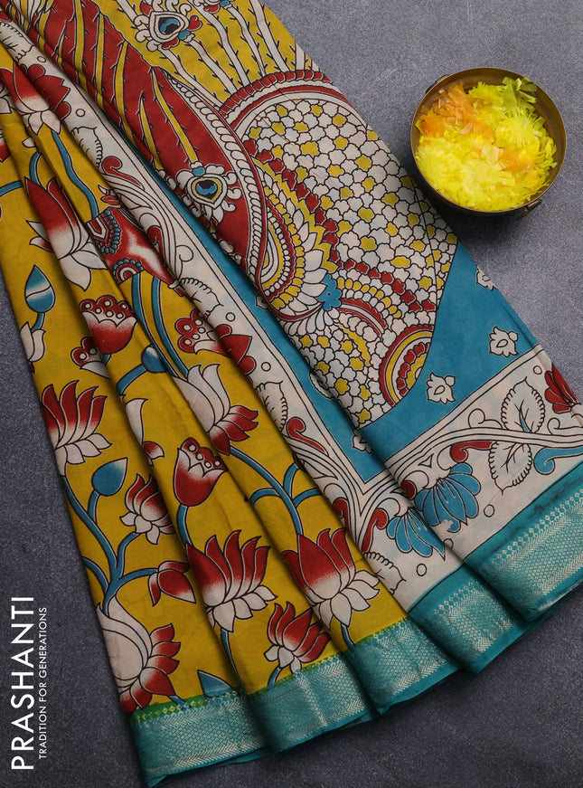 Kalamkari semi silk saree mustard yellow and teal green with allover prints and mangalgiri border