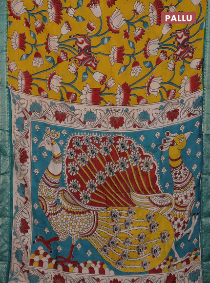 Kalamkari semi silk saree mustard yellow and teal green with allover prints and mangalgiri border