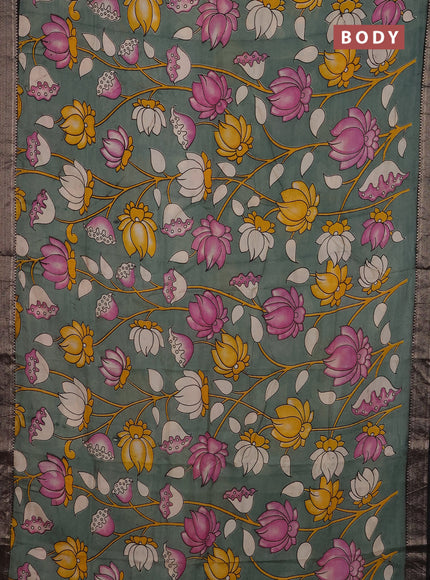 Kalamkari semi silk saree pastel green and black with allover prints and mangalgiri border