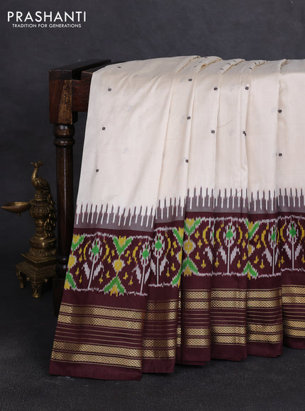 Pochampally silk saree off white and coffee brown with allover thread woven buttas and temple design ikat zari woven boder