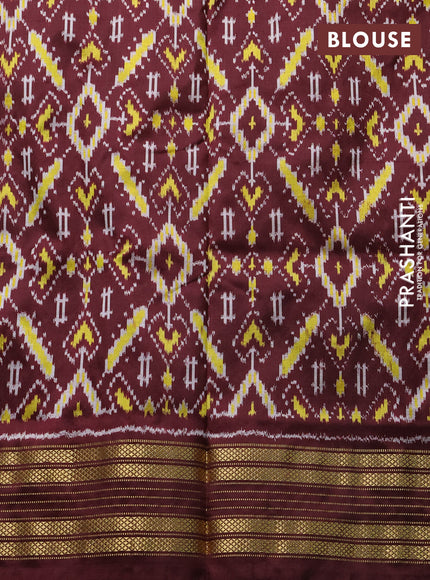 Pochampally silk saree off white and coffee brown with allover thread woven buttas and temple design ikat zari woven boder