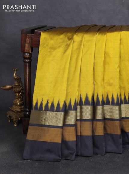 Pochampally silk saree dark mustard and black with plain body and temple design zari woven simple border