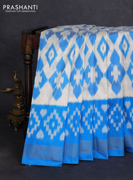 Pochampally silk saree off white and cs blue with allover ikat weaves and ikat zari woven border