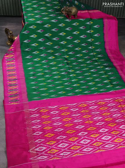 Pochampally silk saree green and pink with allover ikat woven buttas and zari woven ikat butta border