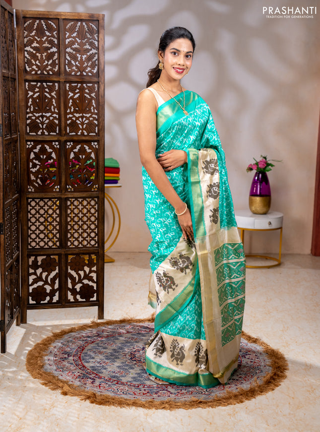 Pochampally silk saree teal green and cream with allover ikat weaves and ikat woven buttas & zari woven border