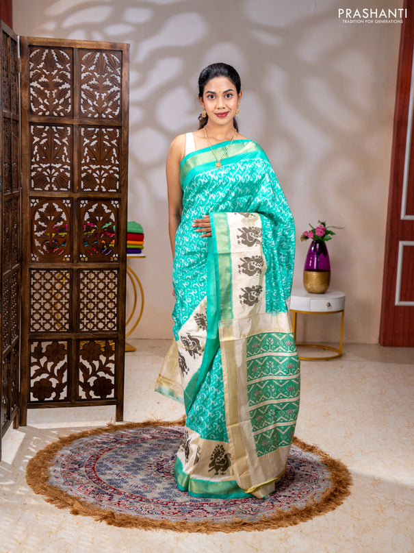 Pochampally silk saree teal green and cream with allover ikat weaves and ikat woven buttas & zari woven border