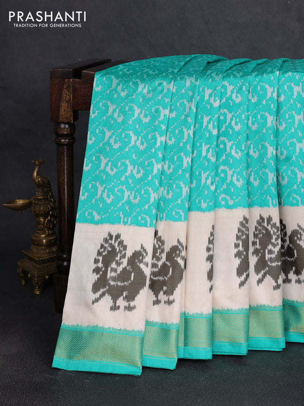 Pochampally silk saree teal green and cream with allover ikat weaves and ikat woven buttas & zari woven border