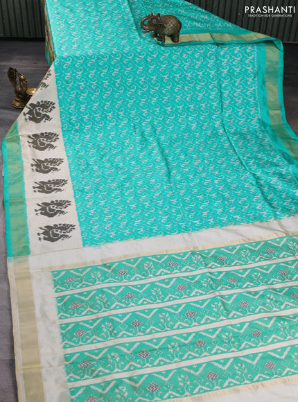 Pochampally silk saree teal green and cream with allover ikat weaves and ikat woven buttas & zari woven border