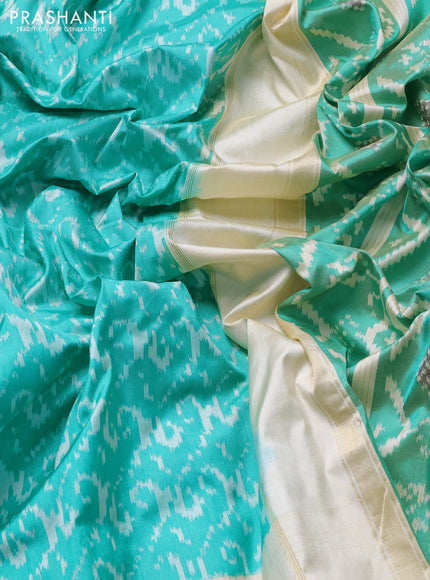 Pochampally silk saree teal green and cream with allover ikat weaves and ikat woven buttas & zari woven border