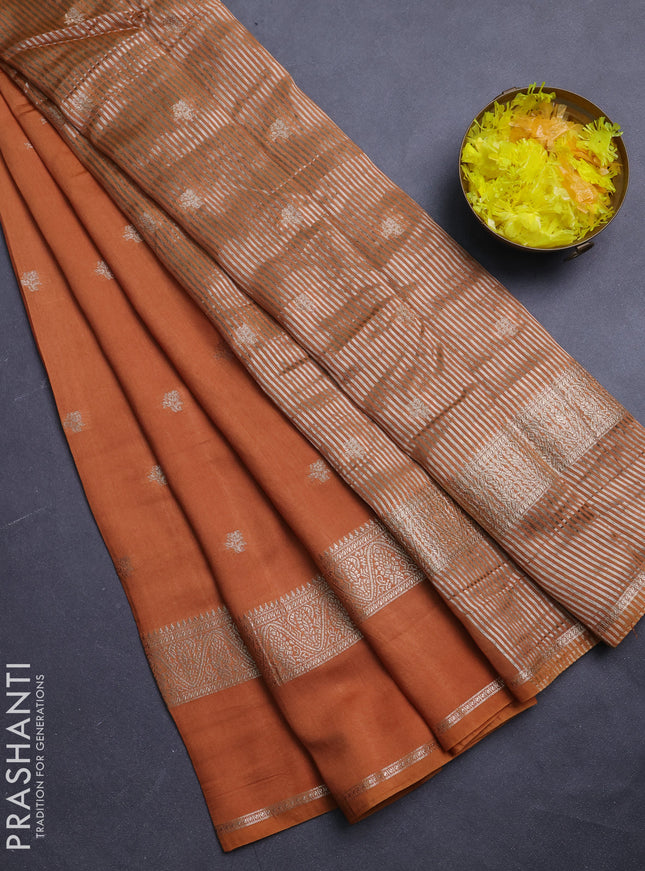 Semi chanderi saree rust shade and black with allover zari woven buttas and rettapet zari woven border