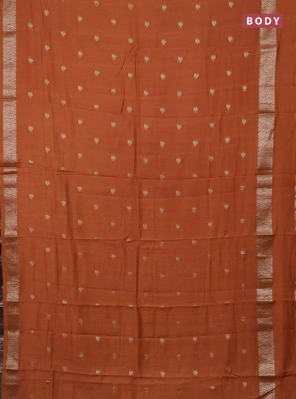 Semi chanderi saree rust shade and deep wine with allover zari woven buttas and rettapet zari woven border