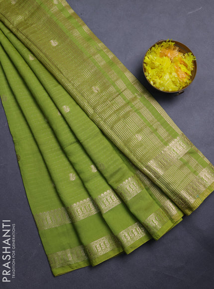 Semi chanderi saree light green and violet with allover zari woven buttas and rettapet zari woven border