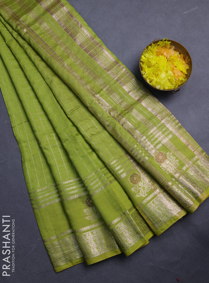 Semi chanderi saree light green and purple with allover zari checked pattern and rettapet zari woven butta border