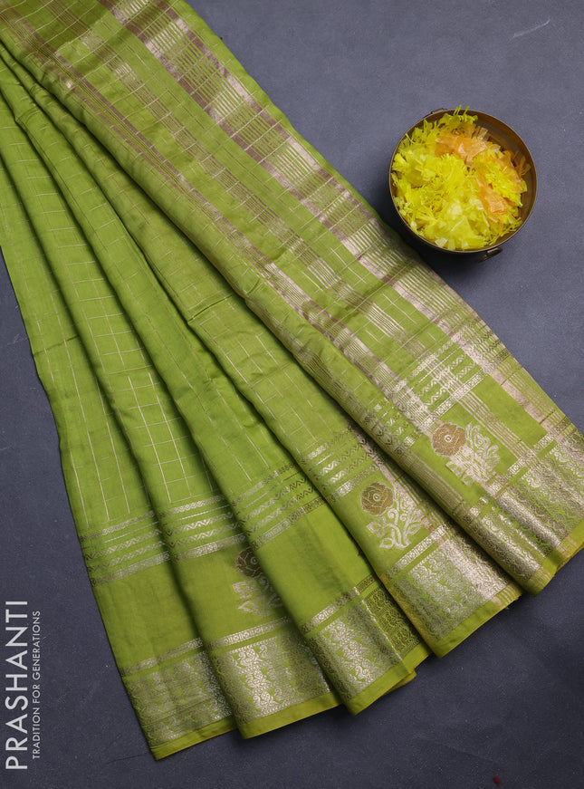 Semi chanderi saree light green and purple with allover zari checked pattern and rettapet zari woven butta border