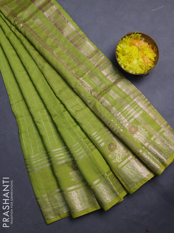 Semi chanderi saree light green and purple with allover zari checked pattern and rettapet zari woven butta border