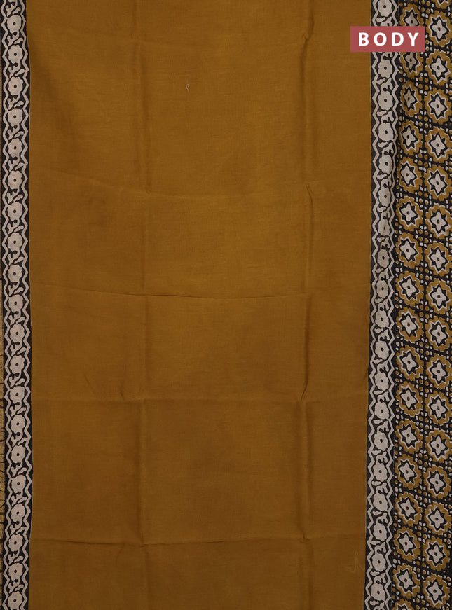 Chanderi Bagru saree dark mustard and black with plain body and small zari woven border