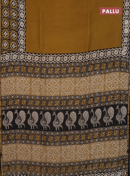 Chanderi Bagru saree dark mustard and black with plain body and small zari woven border