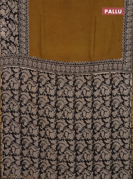 Chanderi Bagru saree dark mustard and black with plain body and small zari woven border