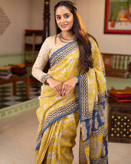 Chanderi Bagru saree yellow and blue with allover prints and small zari woven border