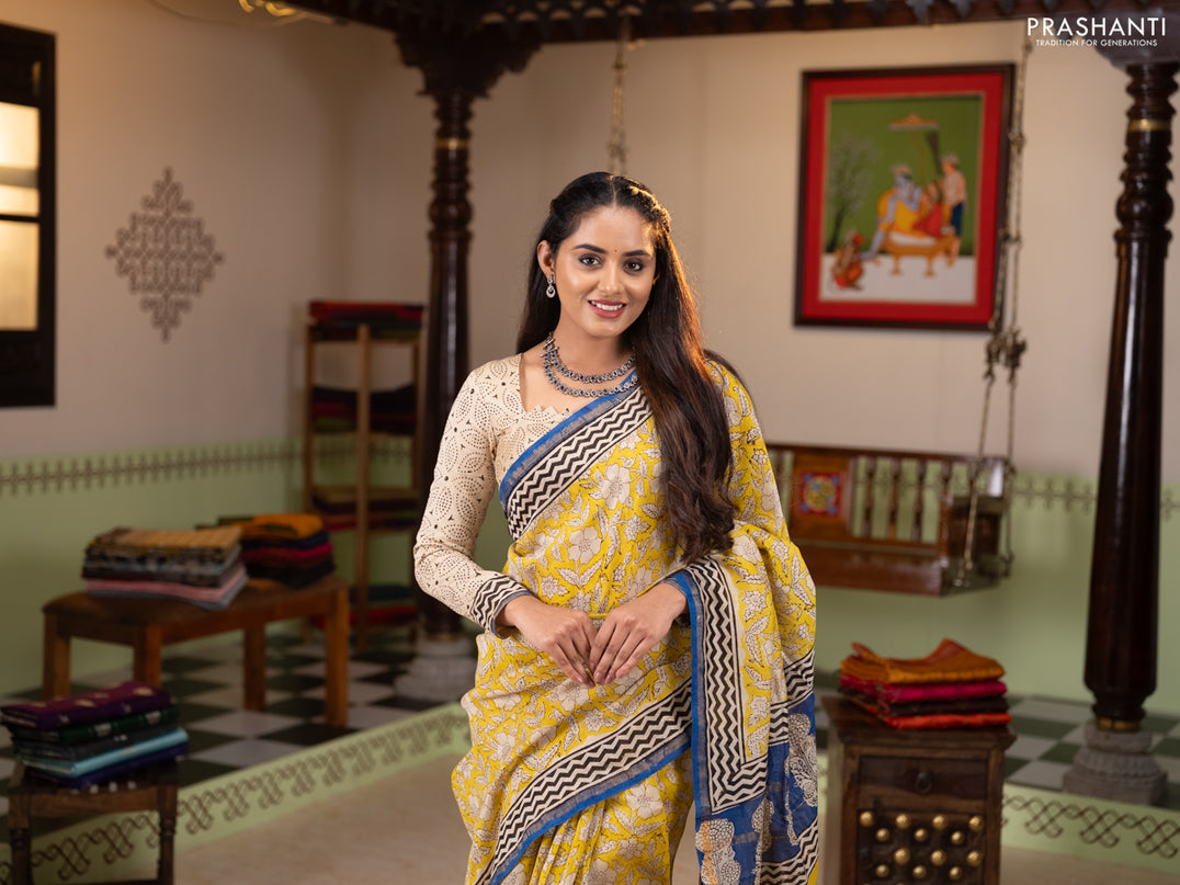Chanderi Bagru saree yellow and blue with allover prints and small zari woven border
