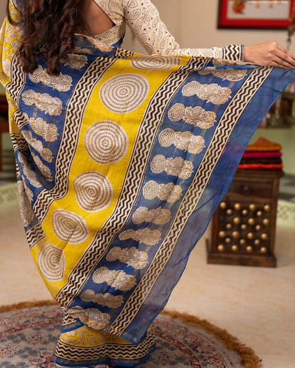 Chanderi Bagru saree yellow and blue with allover prints and small zari woven border