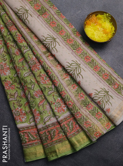 Chanderi Bagru saree light green and orange with allover floral prints and mageshwari border