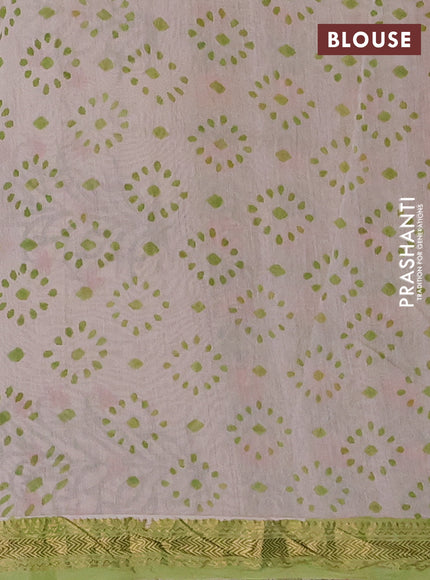 Chanderi Bagru saree light green and orange with allover floral prints and mageshwari border