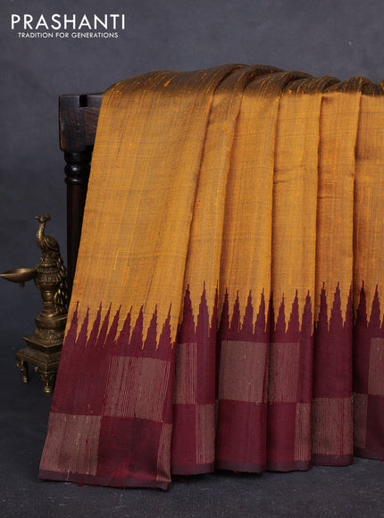 Pure dupion silk saree dark mustard and deep maroon with plain body and temple design zari woven butta border