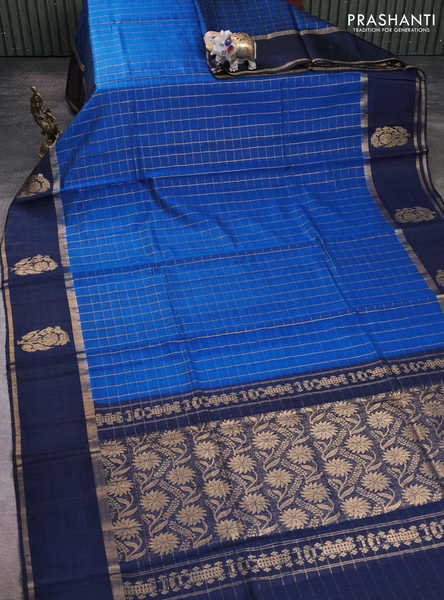 Pure dupion silk saree cs blue and navy blue with allover zari checked pattern and rettapet zari woven butta border