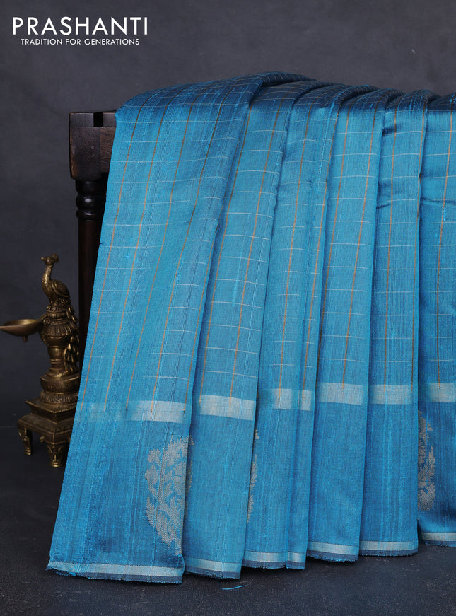 Pure dupion silk saree cs blue with allover zari checked pattern and rettapet zari woven butta border