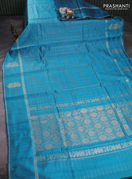 Pure dupion silk saree cs blue with allover zari checked pattern and rettapet zari woven butta border