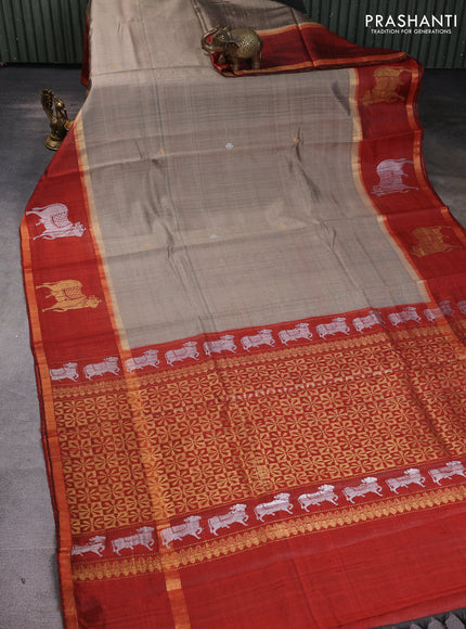 Pure dupion silk saree beige and orange with zari woven buttas and pichwai border