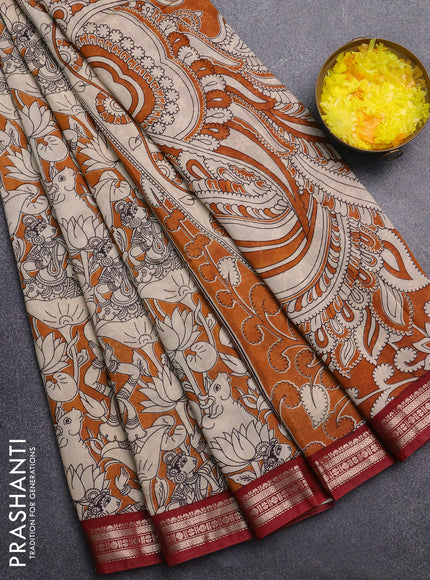 Muslin silk saree dark mustard and maroon with allover pichwai prints and zari woven border