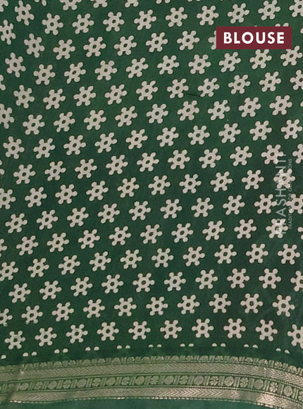 Muslin silk saree rustic maroon and green with allover pichwai prints and zari woven border