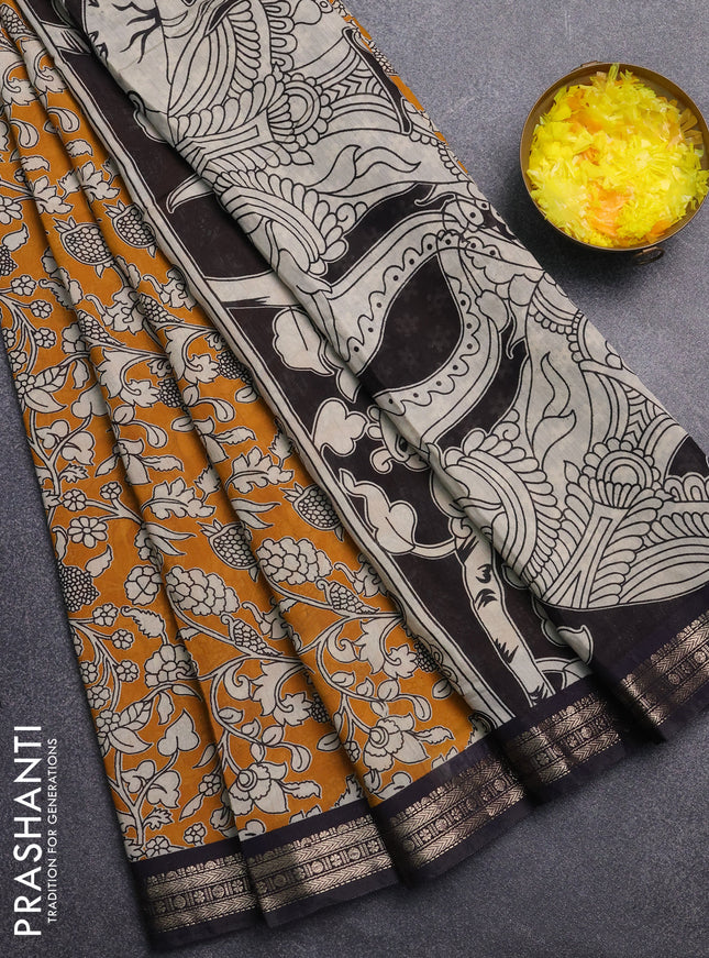 Muslin silk saree mustard yellow and black with allover kalamkari prints and zari woven border