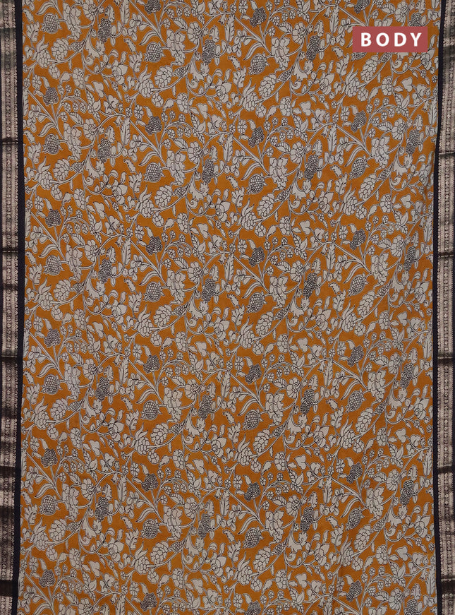 Muslin silk saree mustard yellow and black with allover kalamkari prints and zari woven border