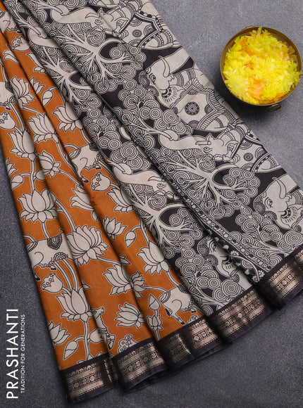 Muslin silk saree dark mustard and black with allover pichwai prints and zari woven border