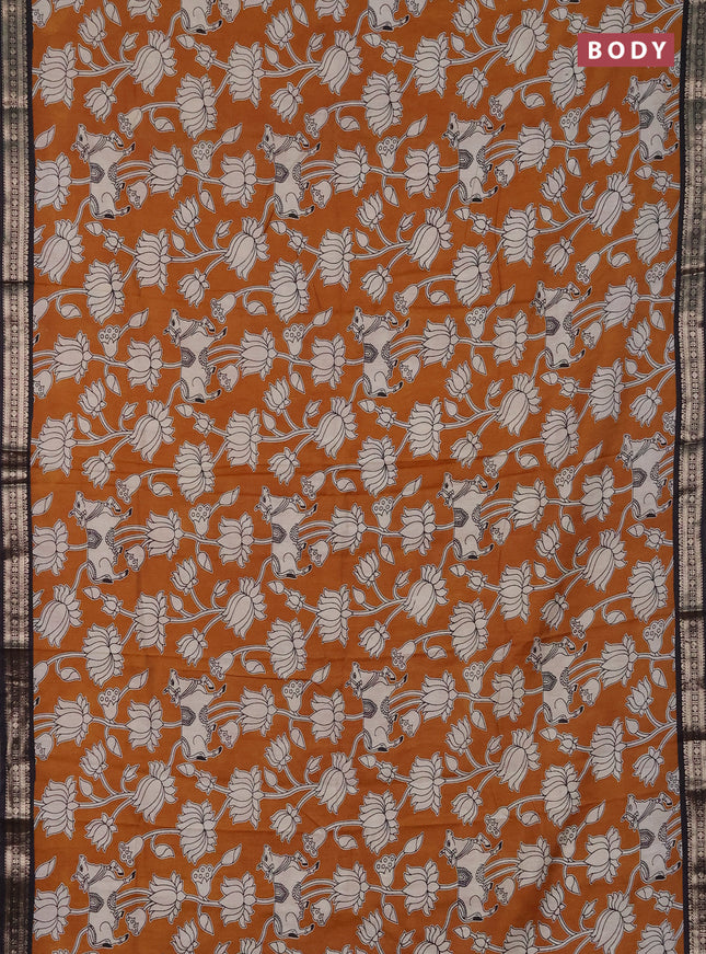 Muslin silk saree dark mustard and black with allover pichwai prints and zari woven border