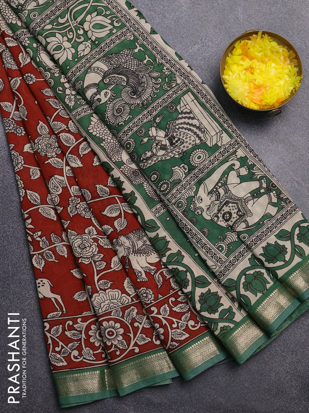 Muslin silk saree rust shade and green with allover kalamkari prints and zari woven border