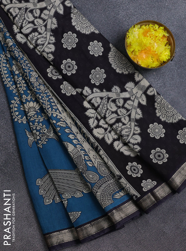 Muslin silk saree cs blue and black with allover kalamkari prints and zari woven border